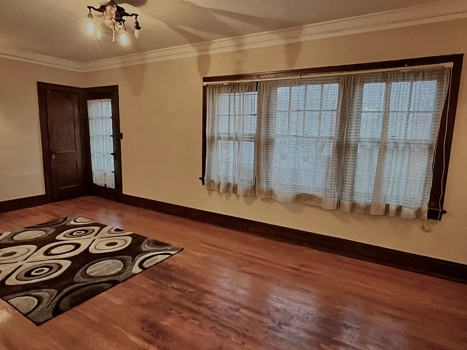 Living room showing closet and door to balcony