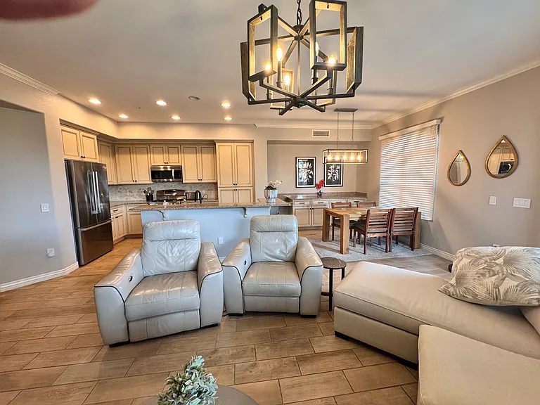 spacious living room area with dining and kitchen