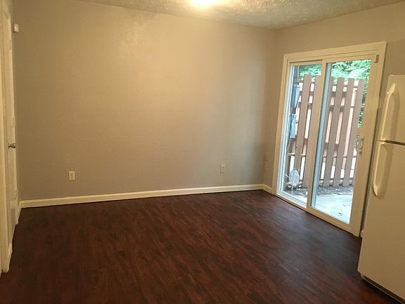 Eat-in kitchen with sliding glass patio door. Storage area o