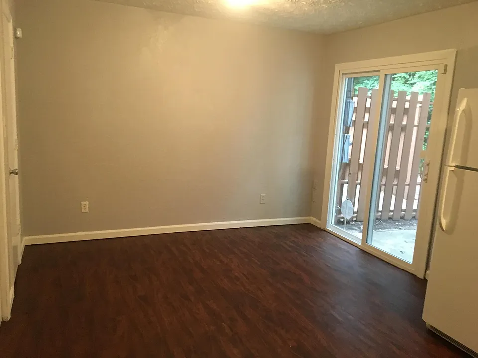 Eat-in kitchen with sliding glass patio door. Storage area o