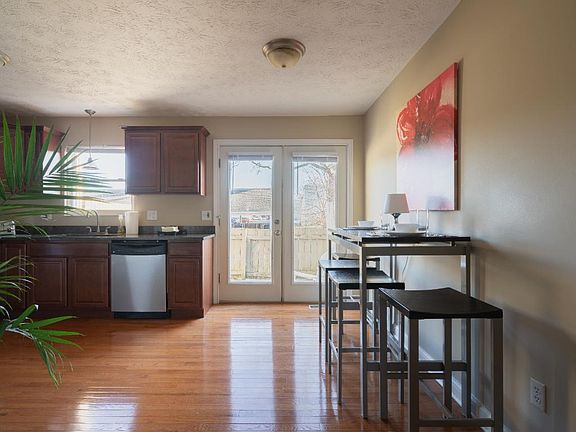 Huge updated kitchen with hardwood floors, all new appliances, eating area, and door to private patio.