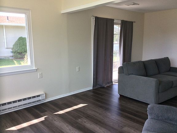 Large living room leads to dining room and hallway to bedrooms.