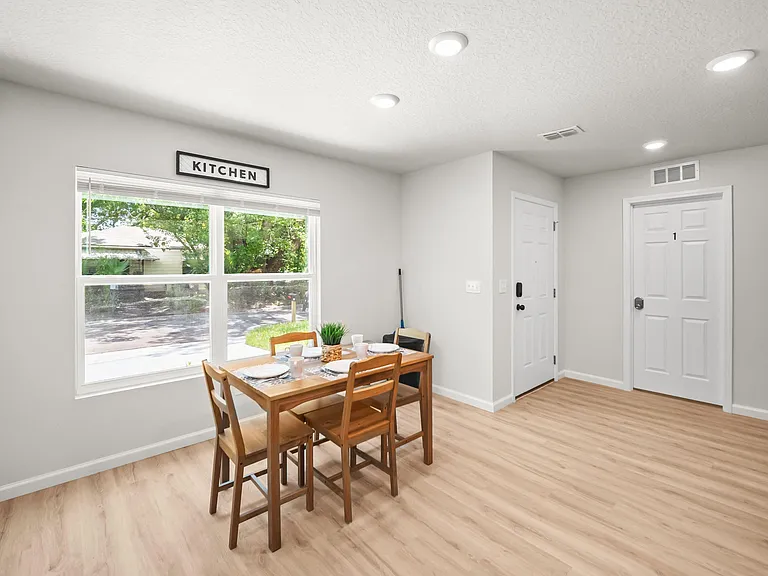 Eat-in dining area with a four-seat table, large window views, and easy flow to the kitchen for everyday meals.