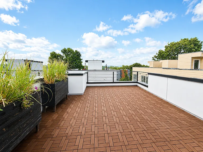 The private rooftop deck offers panoramic views of the Cascades and Mt. Rainier on a clear day!