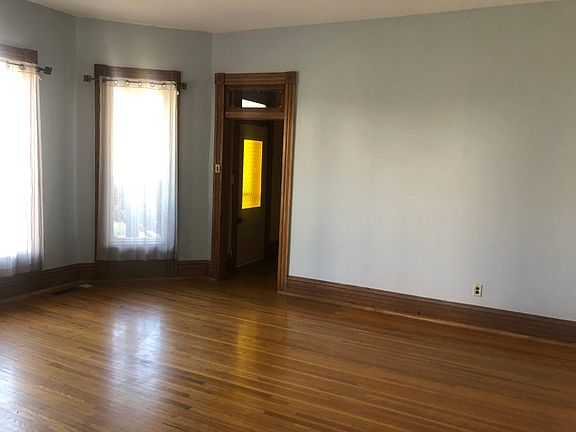 Living room. Nice light from bay windows