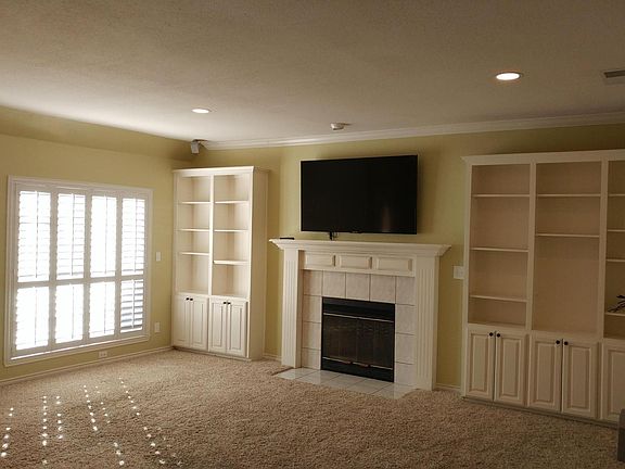 Main area w/ built ins and 65 inch 4k tv