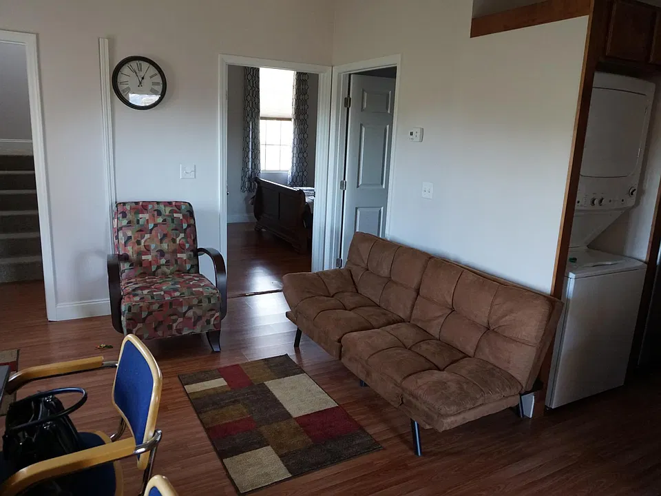 First floor living room looking from front door through the living room