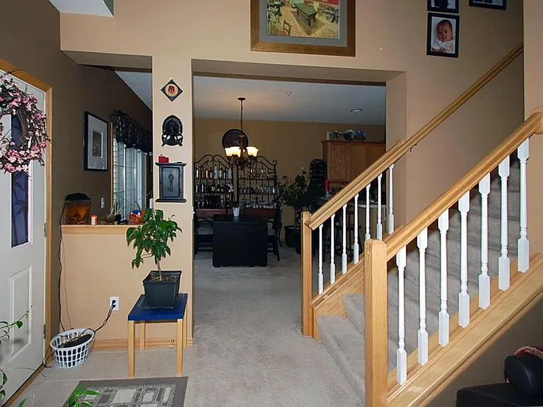 Entrance leading to the second floor. Left side is the dining room. Right side is the livingroom.