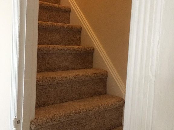 Stairs to the third floor second bedroom, large and private with large closet