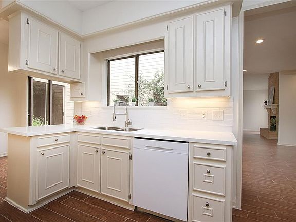 Bright kitchen overlooking courtyard/patio.