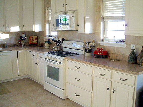 Custom kitchen with 19 feet of 42 inch wall cabinets. Over 16 feet of base cab