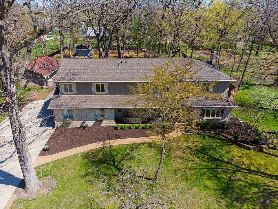 Front Exterior with view of beautiful .95 Acre fenced Back Yard