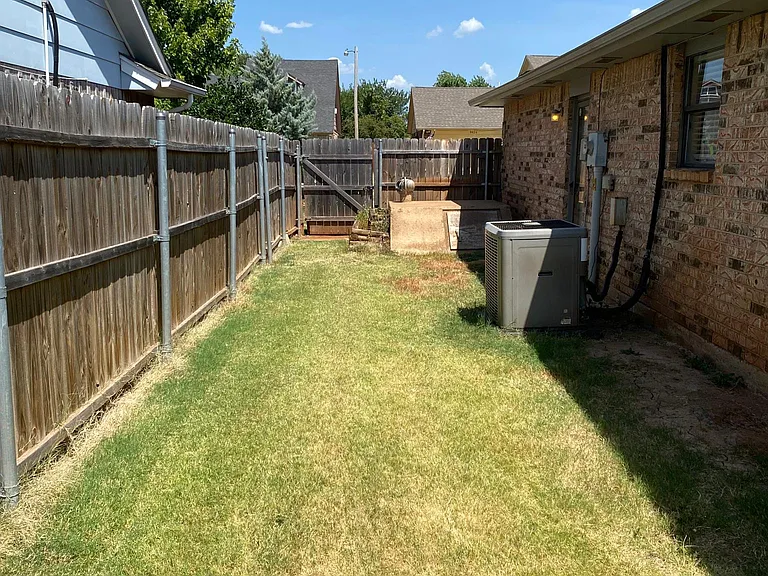 Side yard with storm cellar