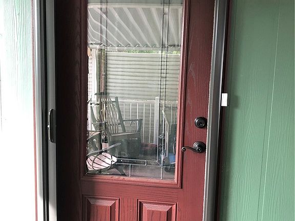 Front door with large privacy glass.