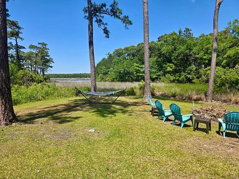 Backyard, fire pit, and hammock