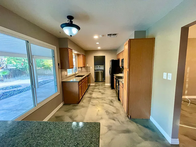 large galley kitchen pass-through to laundry room and garage