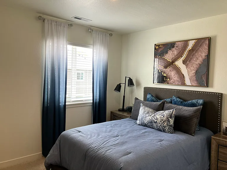 Sample of same floor plan, different finishes, staged with furniture.