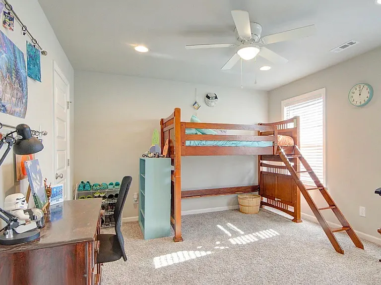 Secondary bedroom #2 over looks front of house with walk in closet