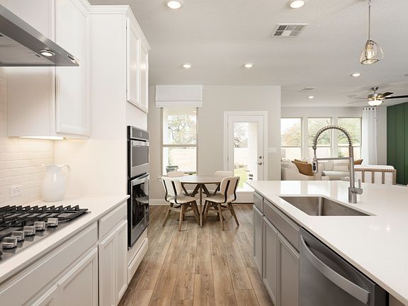Large kitchen island overlooks main living spaces