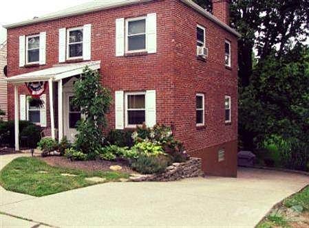 Cute & Charming! Lovely landscaping, spacious driveway leads to oversized 2-car rear garage. Newer c