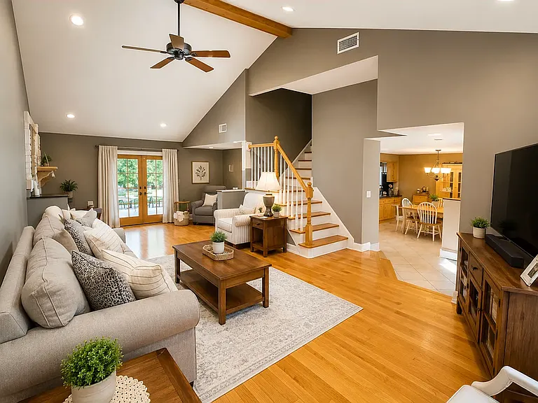 2 part living room with raised ceilings & skylight