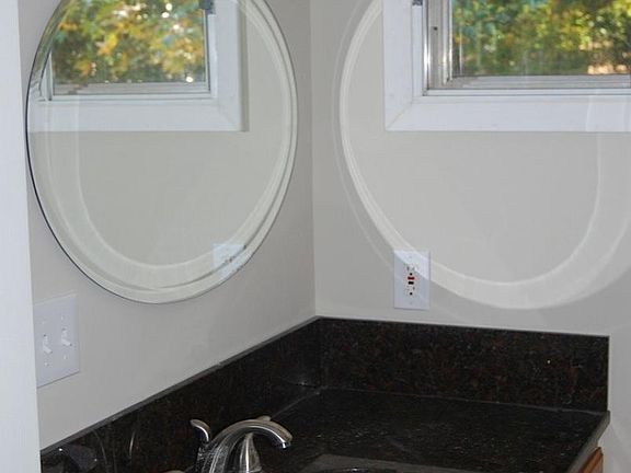 granite in bathrooms, tile on floor