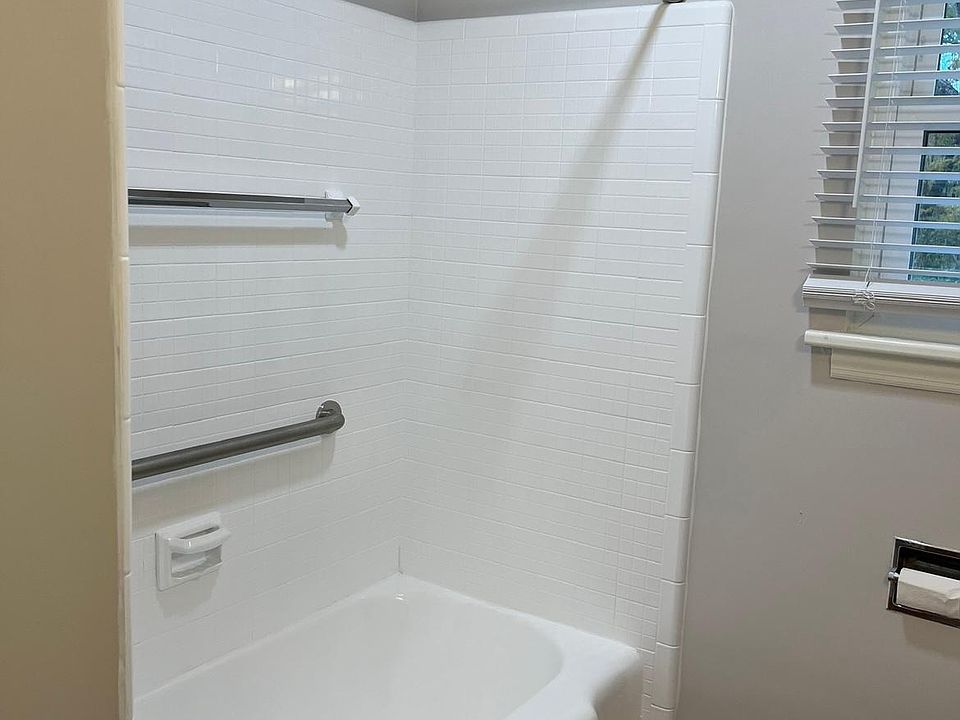 Tub and tile has been reglazed and looks like new.