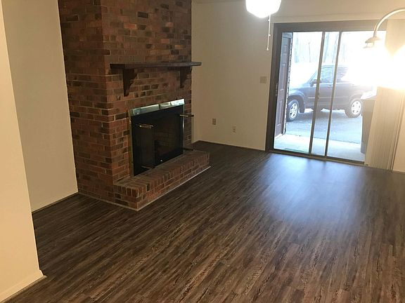 LR and fireplace view to back parking area