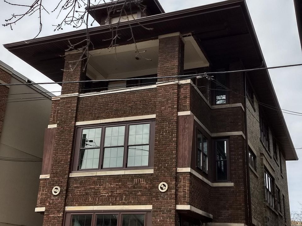 The 528 West Washington entrance is at the back of the building by the parking area.