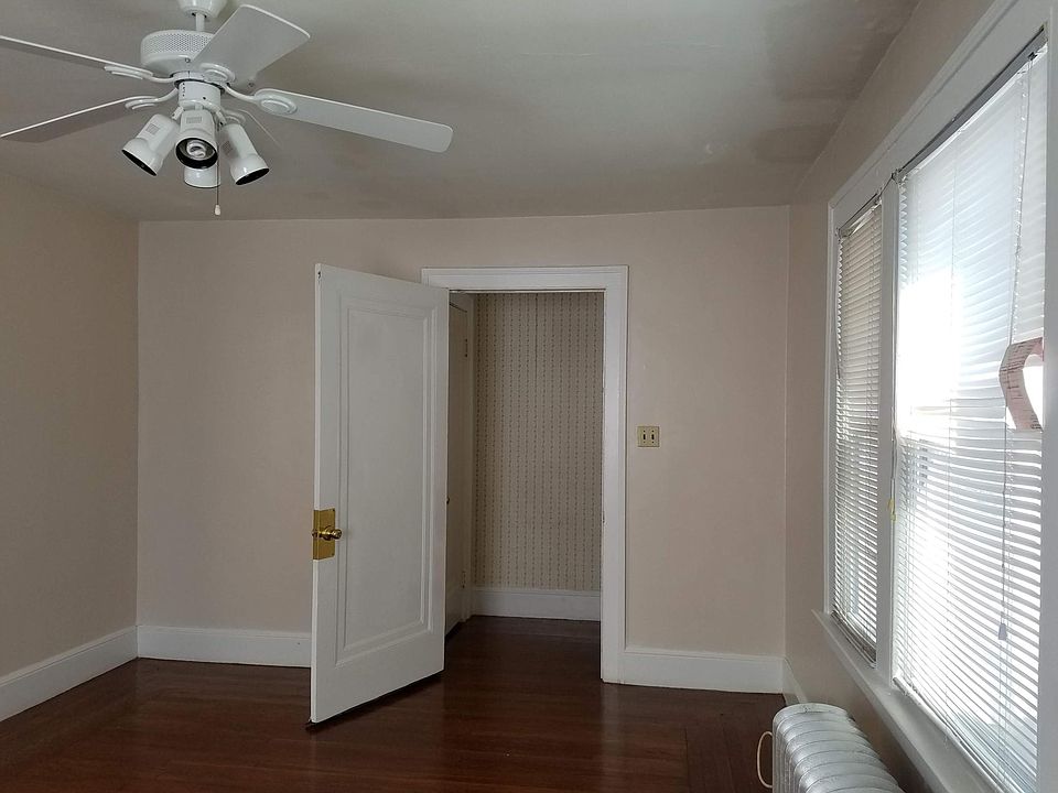 View of living room area. Beyond the doors is a hallway that leads to the front door for exit.