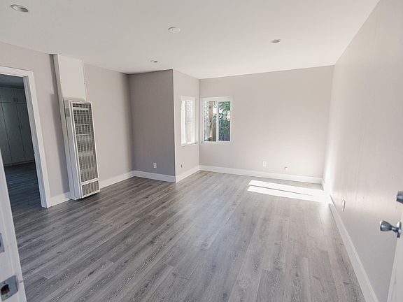 Living room view from front door. Ceiling fan has been installed after this photo was taken