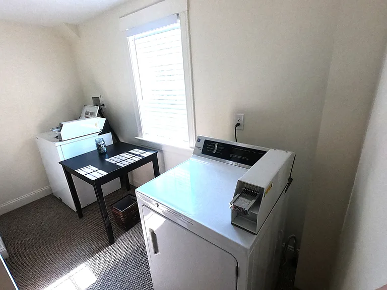 Shared laundry in the hallway for only Units 2 and 3.