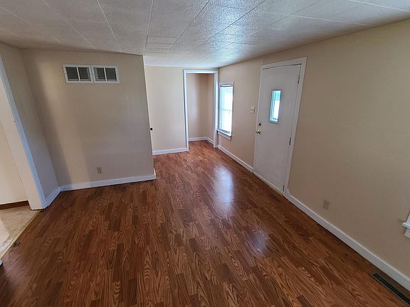 Living Room looking toward front door and stairway up., (kitchen to the left)