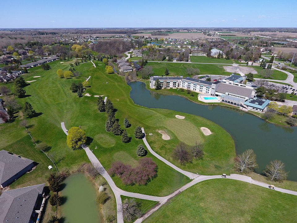 Care free living in this stunning Condo. This well-appointed home features a two way fireplace, vaulted ceilings, crown moldings and an airy open floor plan. You will lose yourself in the custom kitchen complete with granite counter tops, soft closing drawers, under cabinet lighting and a stainless range with cast iron grill and wok area. The living room offers views to the golf course, water and an elevated deck. The home boasts three bedrooms with the Master Suite being an oasis. The Master has a private entrance to the deck where you may enjoy your morning coffee as the sunrises. Or, you are just steps away from the private bath that boasts custom tile walk in shower and his and her vanity. There is plentiful storage here including multiple walk in closets, two car garage and a full basement. This Condo features custom landscaping and is located in the Bay Valley Resort with quick access to I-75 and M-84. HOA is $200 a month. New roof to be completed in Summer of 2017.