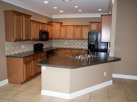 Kitchen Includes: double door fridge w/ ice & water in door,