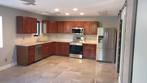 Large open kitchen. Sink, Dishwasher, stove, microwave, and refrigerator . - 2224 N 15th Ave
