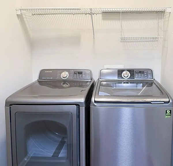 Laundry space off the kitchen. Washer and dryer are included.