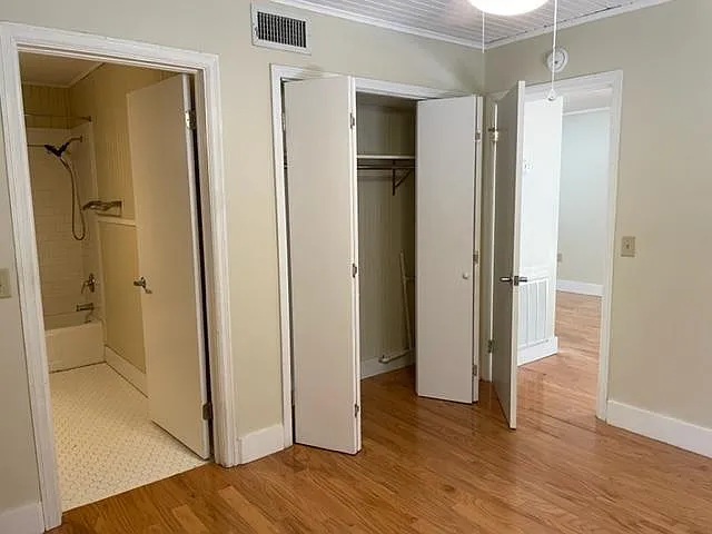 Bedroom closet and into bathroom