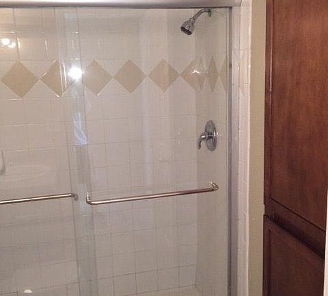 Glass enclosed shower and medicine closet