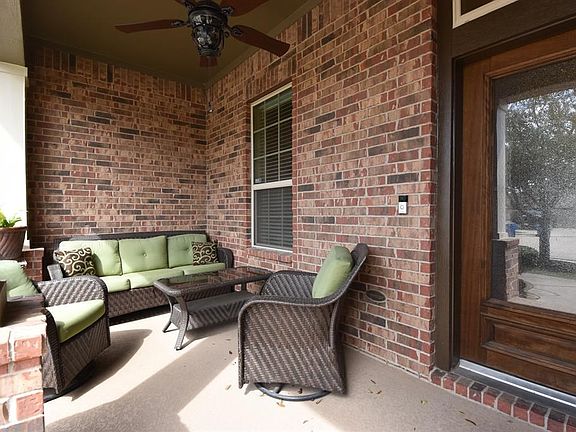 Over-sized front porch.  Great for sitting and visiting.  Designer outdoor ceiling fan for warmer evenings.