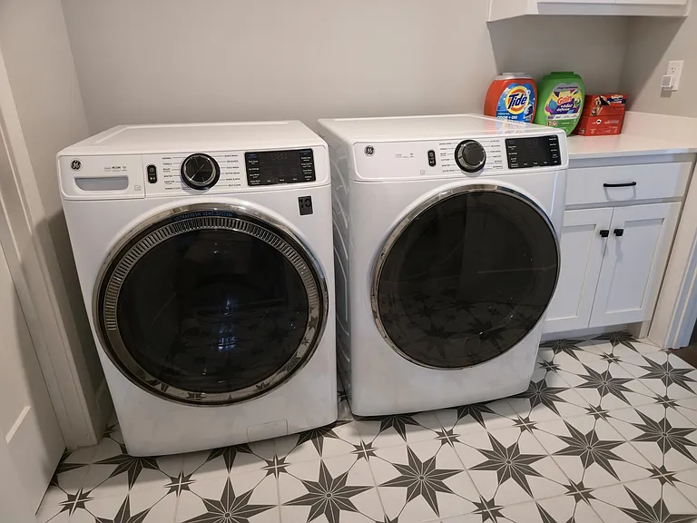 Newer GE washer and dryer included, featuring steam settings