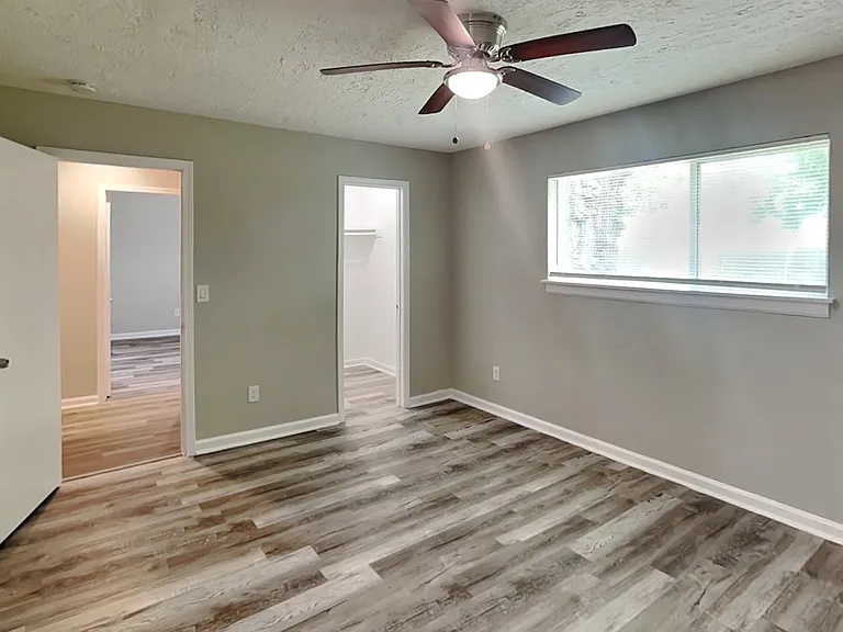 Spacious bedroom with neutral