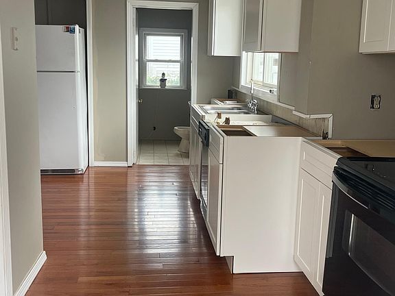 Newly remodeled kitchen with hardwood floors, soft close cabinets and granite countertops (installation next week)