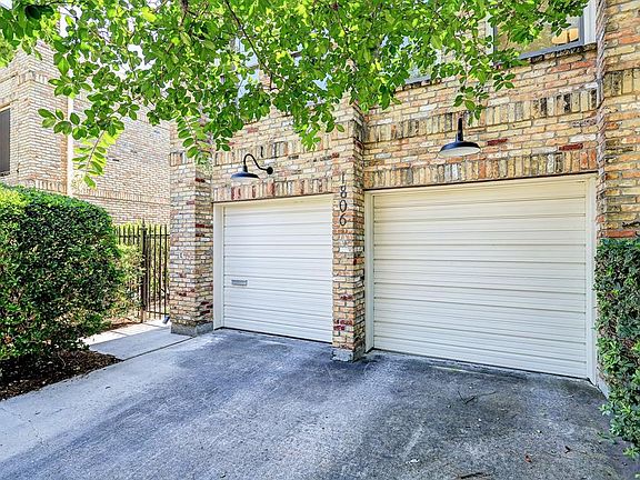 Two single garage doors with additional driveway parking. Not common in the Heights.