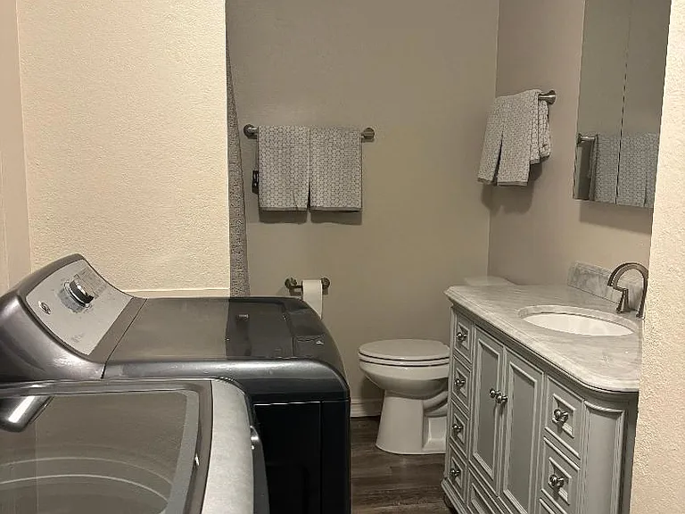 Main bathroom with beautiful vanity and upgraded fixtures.