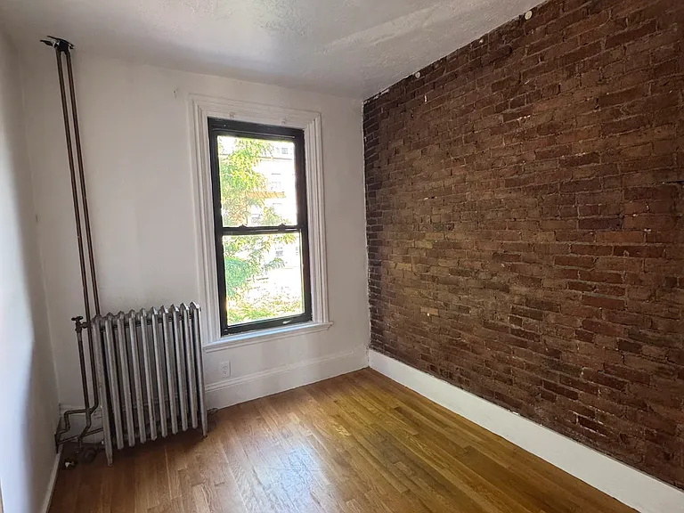 East Facing Window Room with Charming Southend Exposed Brick Wall + Closet