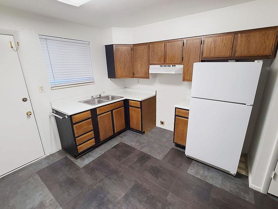 Kitchen at back door. Note that an oven was installed after the photo was taken.
