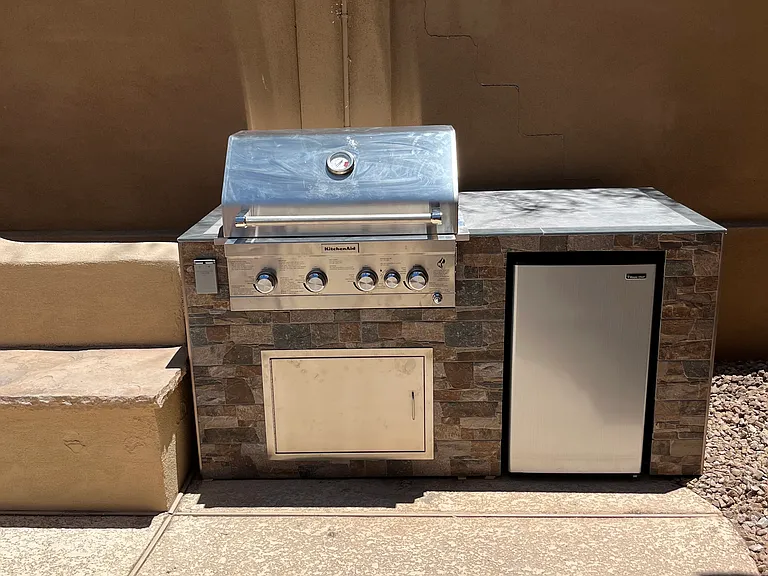 Built in propane grill and small fridge