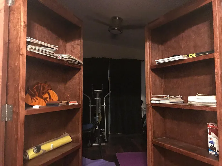 Bookshelf opens to Gym