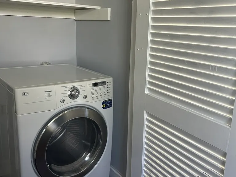 Built-in laundry with lots of storage.